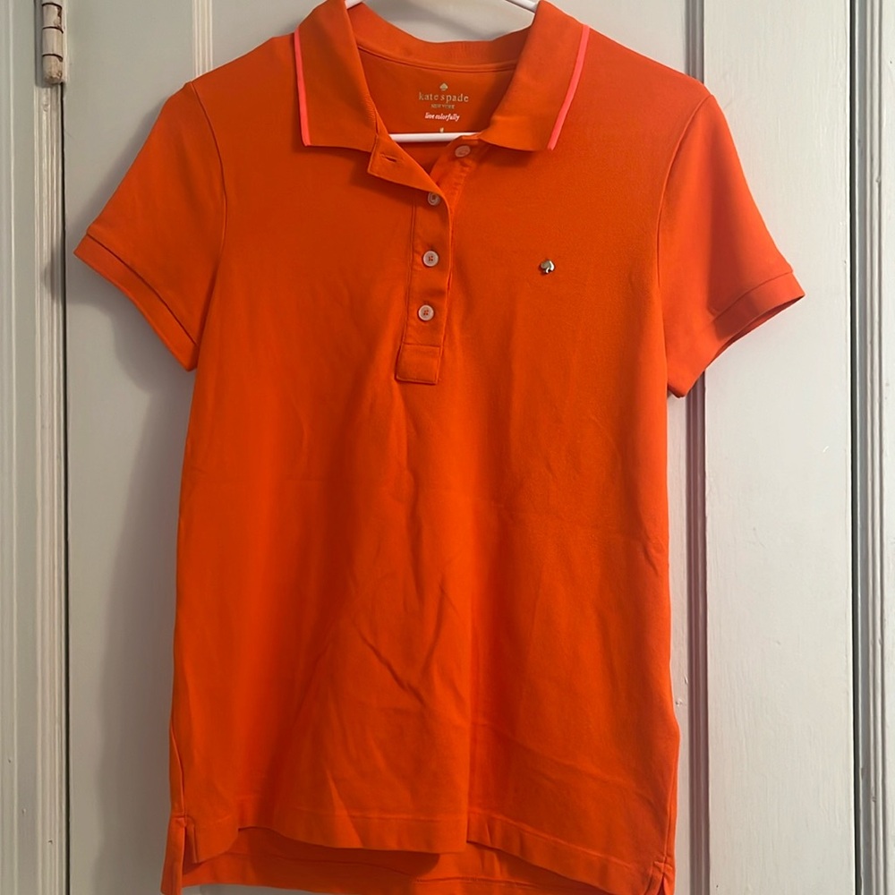 Bright true orange polo with pink outline on collar